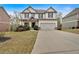 Beautiful two-story home with lush front lawn and two-car garage at 822 Pine Way, Dallas, GA 30157