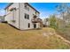 View of the rear exterior of the home featuring a deck and a spacious backyard at 822 Pine Way, Dallas, GA 30157