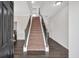 Bright and airy foyer with hardwood floors and staircase at 822 Pine Way, Dallas, GA 30157