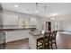 Spacious kitchen island provides extra seating and workspace, enhancing the modern, open-concept design at 822 Pine Way, Dallas, GA 30157