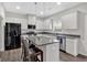 Beautiful kitchen features white cabinets, granite countertops, a center island, and stainless steel appliances at 822 Pine Way, Dallas, GA 30157