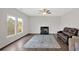 Comfortable living room features a fireplace and large windows for natural light at 822 Pine Way, Dallas, GA 30157