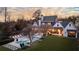 Expansive backyard with a pool, outdoor lounge, manicured lawn, and mature landscaping at 5495 Mount Vernon Pkwy, Atlanta, GA 30327