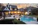 Backyard haven with lush greenery surrounding the inviting swimming pool and spa at 5495 Mount Vernon Pkwy, Atlanta, GA 30327