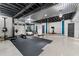 Spacious basement features an exercise area with gym equipment and an elevated platform with stationary bike at 5495 Mount Vernon Pkwy, Atlanta, GA 30327