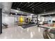 Open concept basement space with fitness equipment, ping pong table, and recreation areas at 5495 Mount Vernon Pkwy, Atlanta, GA 30327