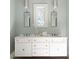 Bright bathroom features a double sink vanity, a window, and decorative pendant lights at 5495 Mount Vernon Pkwy, Atlanta, GA 30327