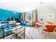 Upstairs bonus room features an eclectic decor with blue accent wall, game area, and dining space at 5495 Mount Vernon Pkwy, Atlanta, GA 30327
