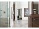 Hallway with Herringbone floors, cabinet and shower leading to a bedroom with decor at 5495 Mount Vernon Pkwy, Atlanta, GA 30327