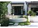 Lush backyard with circular hot tub and surrounding landscaping, complemented by the elegant home exterior at 5495 Mount Vernon Pkwy, Atlanta, GA 30327