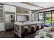 Gourmet kitchen features a large island with seating, a gas range, and high-end appliances at 5495 Mount Vernon Pkwy, Atlanta, GA 30327