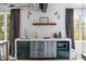 Modern kitchenette features stainless steel appliances and contemporary decor elements at 5495 Mount Vernon Pkwy, Atlanta, GA 30327