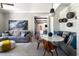 Open living room with marble table, lots of natural light and decorative art at 5495 Mount Vernon Pkwy, Atlanta, GA 30327