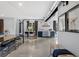 Bright living room with industrial accents, a kitchen area, and modern furnishings at 5495 Mount Vernon Pkwy, Atlanta, GA 30327