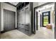 Well-organized mudroom with built-in storage lockers and stylish decor provides a functional and appealing entryway at 5495 Mount Vernon Pkwy, Atlanta, GA 30327