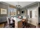 Stylish office with textured wallpaper, a large window, and sophisticated furnishings at 5495 Mount Vernon Pkwy, Atlanta, GA 30327
