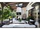 Cozy outdoor seating area with fireplace, mounted TV, and a stylish hanging chair at 5495 Mount Vernon Pkwy, Atlanta, GA 30327