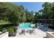 Beautiful pool area with lounge chairs, waterfall feature, and a relaxing outdoor space at 5495 Mount Vernon Pkwy, Atlanta, GA 30327