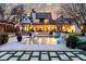 Stunning backyard oasis with pool, spa, waterfall feature, and covered outdoor living space at 5495 Mount Vernon Pkwy, Atlanta, GA 30327