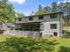 Large screened in porch with an access to a well-maintained lawn and fenced backyard at 110 Myers Dr, Alpharetta, GA 30009