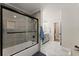 Modern bathroom showcases tiled shower, black hardware, and gray ceramic tile floors at 110 Myers Dr, Alpharetta, GA 30009