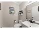 Elegant half bathroom showcasing modern fixtures, a stylish mirror, and a neutral color palette at 110 Myers Dr, Alpharetta, GA 30009