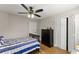 Bedroom featuring hardwood floors, ceiling fan, and closet space at 110 Myers Dr, Alpharetta, GA 30009