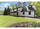 Stylish home with a covered front porch, charming details and a spacious yard at 110 Myers Dr, Alpharetta, GA 30009