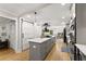 Bright kitchen with a large center island, modern appliances, and open to the dining area at 110 Myers Dr, Alpharetta, GA 30009