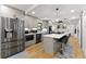 Well-equipped kitchen featuring a large stainless steel refrigerator, center island, and modern appliances at 110 Myers Dr, Alpharetta, GA 30009