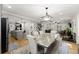Open-concept living area with dining, kitchen and living areas creating the perfect space for entertaining at 110 Myers Dr, Alpharetta, GA 30009