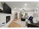 Comfortable living room with a painted fireplace, hardwood flooring and plenty of seating at 110 Myers Dr, Alpharetta, GA 30009