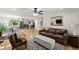 Spacious living room with an open layout, hardwood floors, comfortable seating, and a seamless flow to the kitchen at 110 Myers Dr, Alpharetta, GA 30009