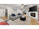 Warm living room featuring a brick fireplace, built-in bookshelves and an abundance of natural light at 110 Myers Dr, Alpharetta, GA 30009