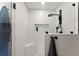Modern shower featuring white subway tile, a corner seat, and sleek black fixtures at 110 Myers Dr, Alpharetta, GA 30009