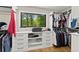 Organized walk-in closet featuring custom shelving, drawers, and ample hanging space at 110 Myers Dr, Alpharetta, GA 30009