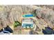 Aerial view of property featuring pool, tennis court, and mature trees at 2667 White Rock Dr, Buford, GA 30519