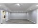 Finished basement featuring modern gray vinyl flooring, recessed lighting, and an open space at 2667 White Rock Dr, Buford, GA 30519