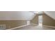Angle shot of bedroom with neutral walls, off-white ceiling and carpet, and two windows with blinds at 2667 White Rock Dr, Buford, GA 30519