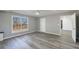 Spacious bedroom featuring gray flooring, neutral paint, large window and a ceiling fan at 2667 White Rock Dr, Buford, GA 30519