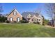 Charming brick home with well-manicured lawn and mature landscaping at 2667 White Rock Dr, Buford, GA 30519