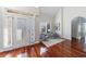 Welcoming foyer with gleaming hardwood floors and a decorative glass door at 2667 White Rock Dr, Buford, GA 30519