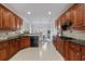 Spacious kitchen with wooden cabinets, granite counters, tile backsplash, and stainless steel appliances at 2667 White Rock Dr, Buford, GA 30519