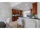 Modern kitchen features wood cabinets, breakfast bar, and tile backsplash at 2667 White Rock Dr, Buford, GA 30519