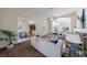 Open concept living room with brick fireplace, sofas, view to the dining room and kitchen at 2667 White Rock Dr, Buford, GA 30519