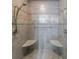 Walk-in shower with dual shower heads, a handrail, and built-in seating at 2667 White Rock Dr, Buford, GA 30519