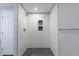 Shower featuring bright white tile, niche, gray flooring and modern hardware at 2667 White Rock Dr, Buford, GA 30519