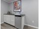 Close up of basement wet bar area featuring neutral walls and gray countertop and cabinets at 2667 White Rock Dr, Buford, GA 30519