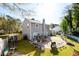 Overhead shot of the house's backyard with a patio, grill, and tire planters at 302 Cimarron Way, Lawrenceville, GA 30044