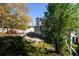 Inviting backyard featuring a patio, a swing and a colorful fence, perfect for relaxation and entertaining at 302 Cimarron Way, Lawrenceville, GA 30044